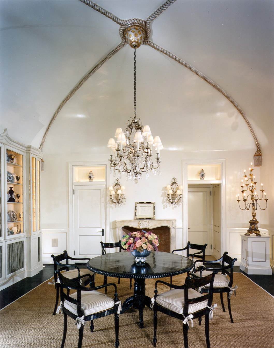 High-ceilinged living room with traditional chandelier