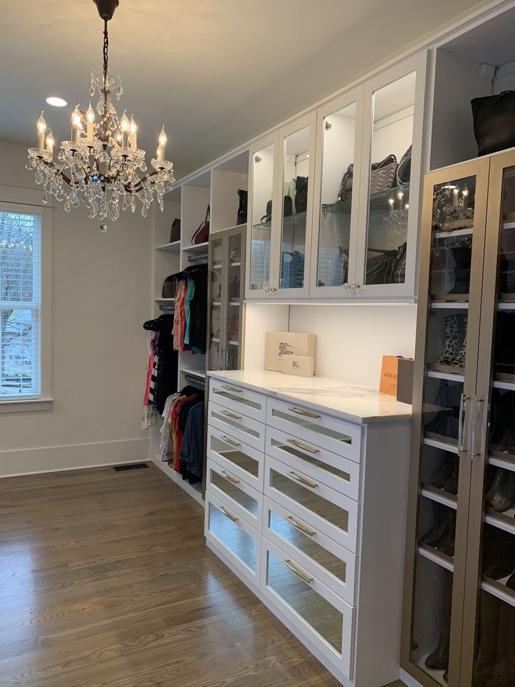 Stunning Master Closet with Chandelier | Custom closet design