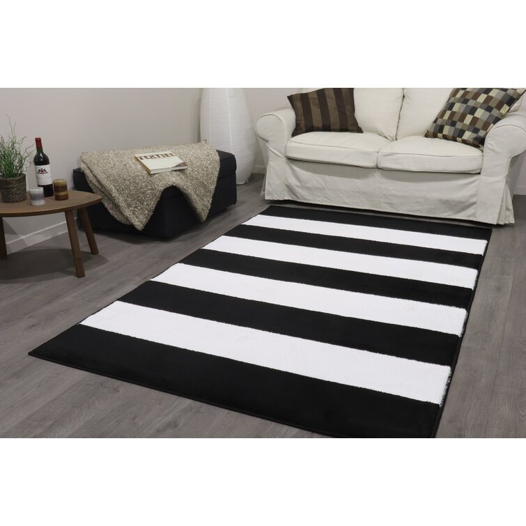 Striped black and white area rug